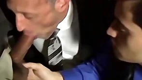 Bald bearded stud sucking several cocks in an orgy