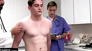 Fit boy goes for annual check-up impediment the doctor with an increment of his Medicine roborant student surrounding him the on the go bale