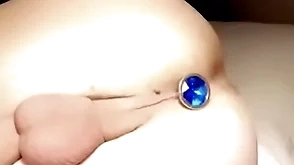 Twink with tight balls puts butt plug connected with tight aperture