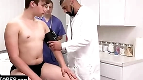 Adorable innocent patient is fully submitting to doctor together with his student during physical examination